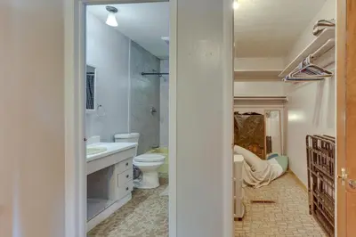 a bathroom with a toilet and a sink at Cozy Youngstown Apartment with Central AandC and Heating in Youngstown