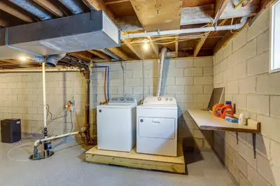 a laundry room with two washer and dryer at Dog-Friendly Port Clinton Home Walk to Lake Erie! in Port Clinton
