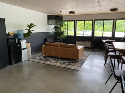 a living room with a couch and a table at The Hemlock Inn in Loudonville