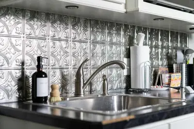 a kitchen counter with a sink and a bottle of wine at Jungle House Luxury Stays - Columbus Downtown Short North in Columbus