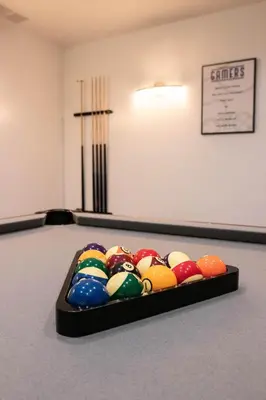 a tray of billiard balls in a pool table at Hunter's Cove in Morehead