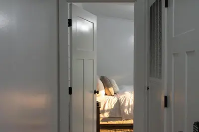a bedroom doorway with a bed in the background at Maple Retreat with Big Pool in Dundee