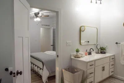 a bathroom with a sink and a mirror at Maple Retreat with Big Pool in Dundee