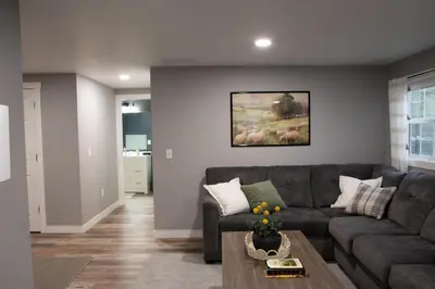 a living room with a couch and a table at Haven on 41 in Warsaw