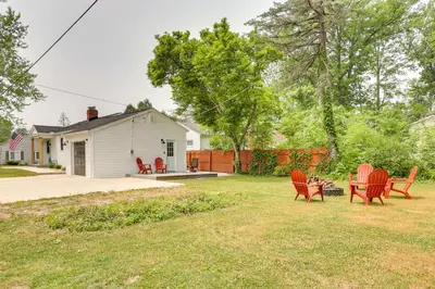 a group of chairs and a table in a yard at Chippewa Lake Cottage with Fire Pit! in Chippewa Lake