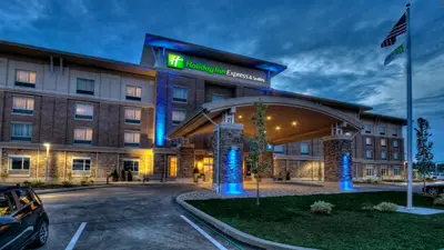 a hotel with a car parked in a parking lot at Holiday Inn Express & Suites Pittsburgh SW/Southpointe by IHG in Canonsburg