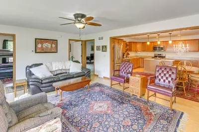 a living room with a couch and a table at WFH-Friendly Columbiana Vacation Rental with Deck! in Columbiana