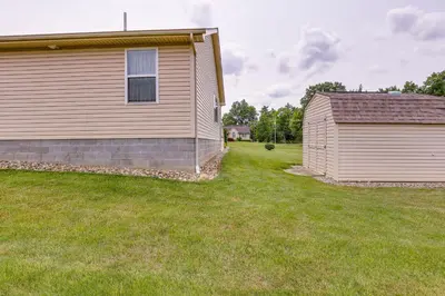 a house and a shed in a yard at WFH-Friendly Columbiana Vacation Rental with Deck! in Columbiana