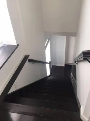 a staircase in a building with a stair case at Luxury three story apartment in SHORT NORTH in Columbus