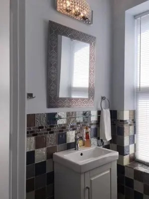 a bathroom with a sink and a mirror at Luxury three story apartment in SHORT NORTH in Columbus