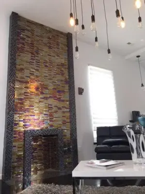 a fireplace in a living room with a brick wall at Luxury three story apartment in SHORT NORTH in Columbus