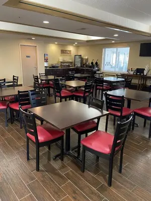 a dining room with tables and chairs in a restaurant at Red Roof Inn Sandusky - Milan in Milan