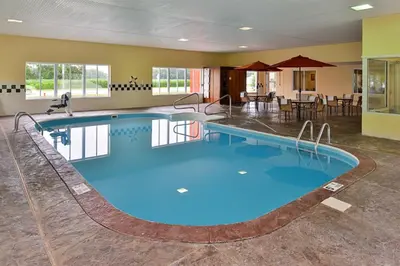 a pool in a hotel room with blue water at Red Roof Inn Sandusky - Milan in Milan
