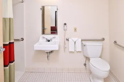 a bathroom with a toilet and a sink at Red Roof Inn Sandusky - Milan in Milan