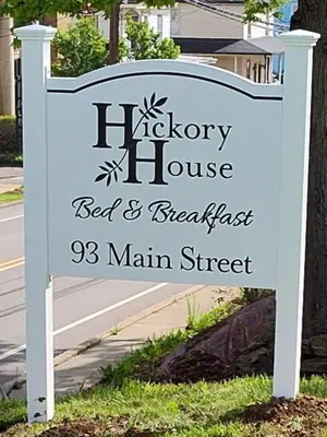a sign for a bed and breakfast main street at Hickory House B & B in Hickory