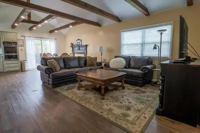 a living room with two couches and a coffee table at Hickory House B & B in Hickory