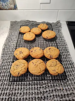 a group of chocolate chip cookies on a cooling rack at Hickory House B & B in Hickory