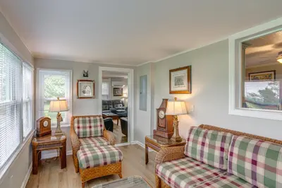 a living room with two chairs and a couch at Welcoming Port Clinton Vacation Rental! in Port Clinton