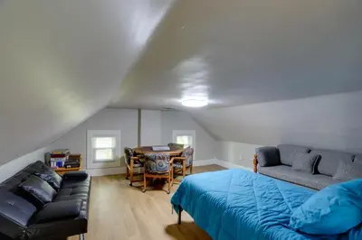 a room with a bed and a couch and a table at Welcoming Port Clinton Vacation Rental! in Port Clinton