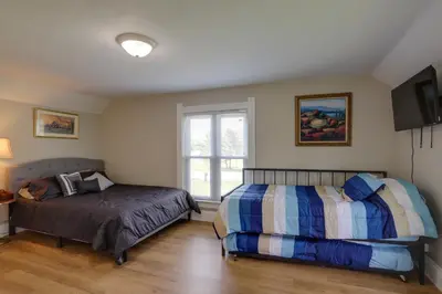 a bedroom with two beds and a window at Welcoming Port Clinton Vacation Rental! in Port Clinton