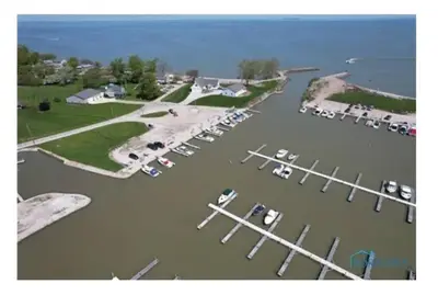 an aerial view of a marina with cars parked at Sunnie Days condo in Oak Harbor on Lake Erie! in Sand Beach