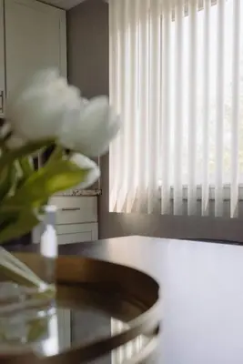 a vase of flowers sitting on a table next to a window at Westlake Harmony in Westlake