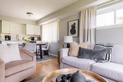 a living room with two couches and a table at Westlake Harmony in Westlake