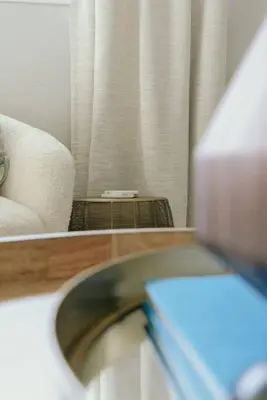 a bathroom with a sink and a chair and a window at Westlake Apartment in Westlake