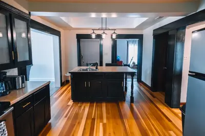 a kitchen with a island in the middle of a room at Downtown Escape Great for large families & groups in Sugarcreek