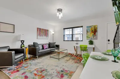 a living room with couches and a table at The Worthington - 3 BR 2 5 Bath and Parking in Columbus