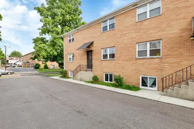 an empty street in front of a brick building at The Worthington - 3 BR 2 5 Bath and Parking in Columbus