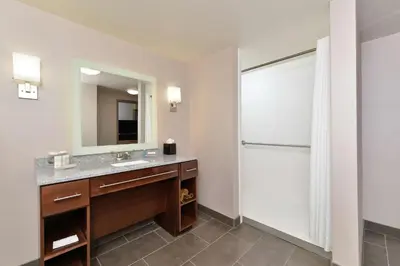 a bathroom with a sink and a mirror at Homewood Suites by Hilton Cincinnati/Mason in Mason