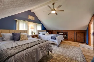 a bedroom with two beds and a ceiling fan at Lakefront St Marys Getaway with Boat Dock and Fire Pit in Southmoor Shores