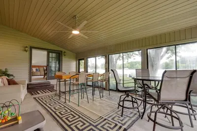 a living room with a table and chairs at Lakefront St Marys Getaway with Boat Dock and Fire Pit in Southmoor Shores