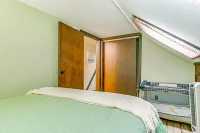 a bedroom with a bed in a room with a window at Lakefront St Marys Getaway with Boat Dock and Fire Pit in Southmoor Shores