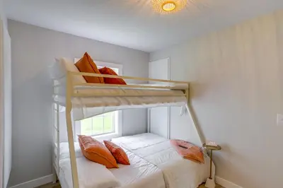 a bedroom with two bunk beds with a window at Port Clinton Vacation Rental with Boat Dock and Grill! in Port Clinton