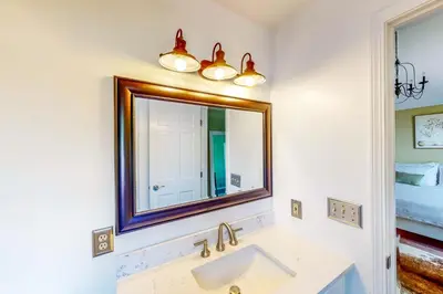 a bathroom with a sink and a mirror at Dog-Friendly Yard! Family Retreat in Fort Wayne in Sunnybrook Acres