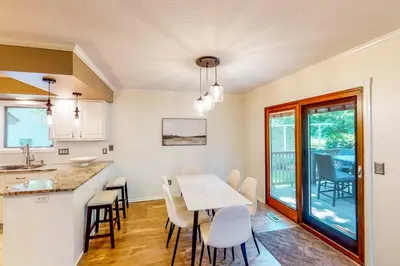 a kitchen and dining room with a table and chairs at Dog-Friendly Yard! Family Retreat in Fort Wayne in Sunnybrook Acres