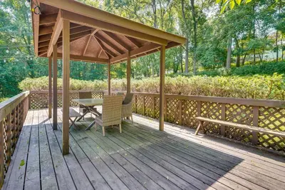 a gazebo with a table and chairs on a wooden deck at Cabin with Deck about 3 Mi to Apple Valley Lake! in Mount Vernon