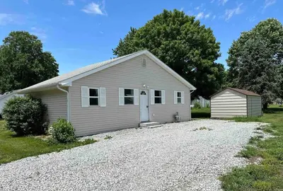 a house with a gravel driveway in front of it at Entire Home in Cambridge City in Cambridge City