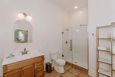 a bathroom with a toilet sink and a shower at East Main Lofts in Madison