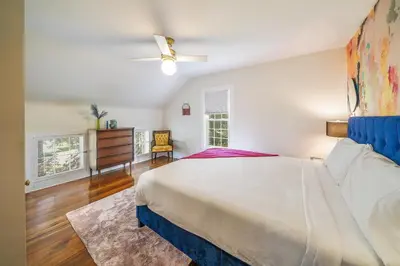a bedroom with a bed and a ceiling fan at Small town vibes in Garrettsville. in Garrettsville