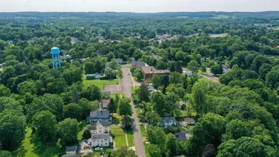 an aerial view of a town with a water tower at Small town vibes in Garrettsville. in Garrettsville