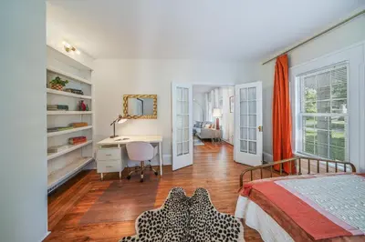 a bedroom with a bed and a desk and a desk at Small town vibes in Garrettsville. in Garrettsville