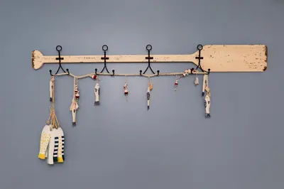 a wooden guitar rack with keys hanging from it at Explorers Cottage at Rye Beach in Huron