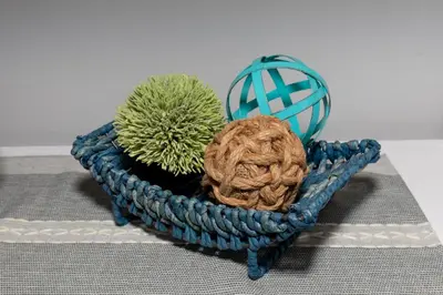 a blue crocheted basket with two plants on a table at Downtown Waterfront Escape in Sandusky