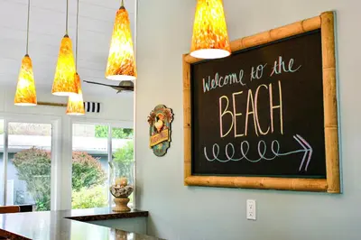 a chalkboard with the words momma be the bear rescue on a wall at Newly Renovated! Old Homestead Beach Home in Huron