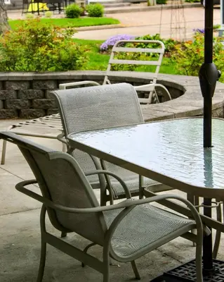 a table and chairs sitting at a table with a table and chairs at Newly Renovated! Old Homestead Beach Home in Huron