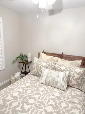 a bedroom with a large bed with pillows on it at Group House Sleeps 26 THE ATTIC - 2 Miles to Cedar Point in Sandusky