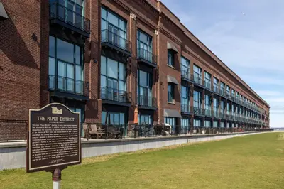 a sign in front of a large brick building at Marlin at the Lake - Downtown Sandusky in Sandusky
